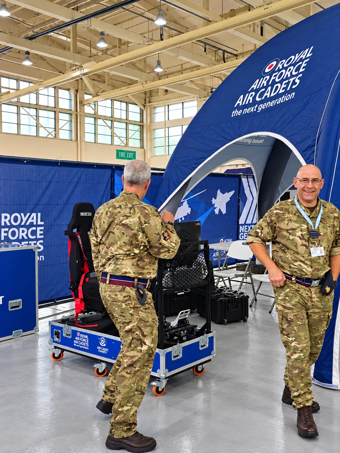 RAF personnel inspecting the All-in-One VR Motion Simulator at an Air Cadet event